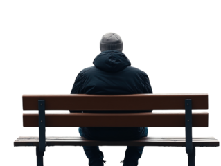 Solitary figure sitting on a bench in an autumn park, viewed from behind.   PNG transparent.