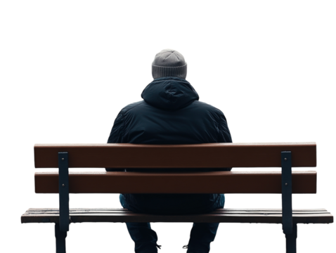 Solitary figure sitting on a bench in an autumn park, viewed from behind.   PNG transparent.