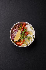 Salad with tuna pieces, boiled egg, cherry tomatoes, lettuce