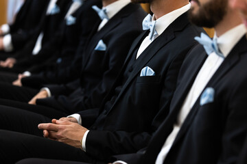Guests sit on benches during a wedding in the Catholic Church.