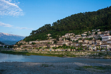 The historic Gorica quarter of Berat in Albania. Berat is UNESCO listed and is known as City of a Thousand Windows. Famous for its traditional Ottoman architecture. Mali Partizan Mountain background
