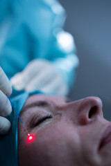 Naklejka premium Middle-aged woman undergoing a face surgery in a private clinic.