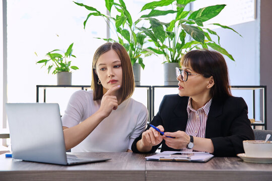 Young female patient at therapy meeting with psychologist, mental therapist