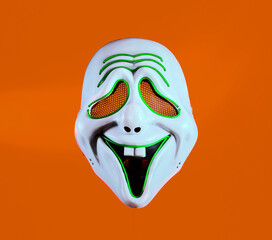 Halloween mask on a orange background.
