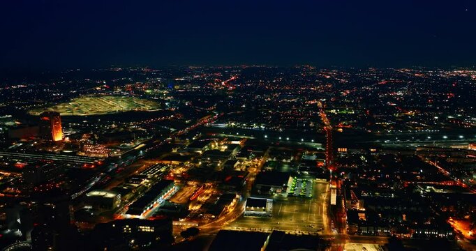 Vibrant nightlife of a modern metropolis. Lively traffic on the highways of Los Angeles, California, USA at night. Aerial view.
