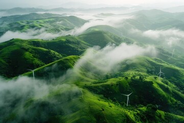 Obraz premium A group of wind turbines sit atop a lush green hillside, generating clean energy