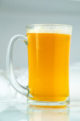 The appearance of a beer glass on a white glass table