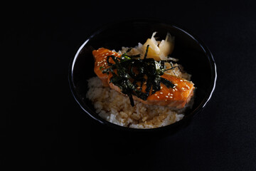 salmon teriyaki suace japanese food isolate in black background