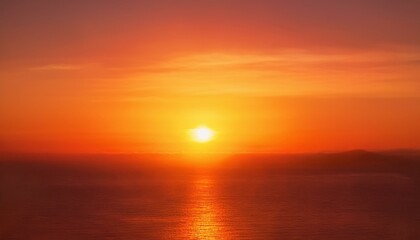 Obraz premium Warm red and orange blurred background resembling a sunset, with gentle glow effects