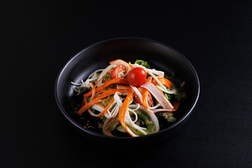 Japanese salad isolated in black background