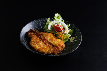 Tonkatsu Traditional Japanese food, Deep Fried Pork Cutlet isolate in black background