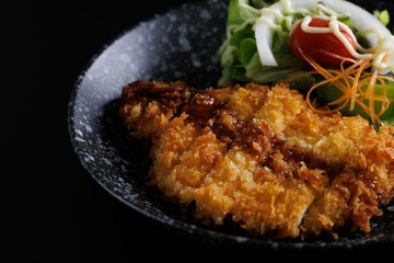Tonkatsu Traditional Japanese food, Deep Fried Pork Cutlet isolate in black background