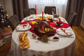 Roasted turkey served on the dining table. Christmas, Thanksgiving time