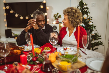 Grandparents having fun at their Thanksgiving, Christmas dinner.