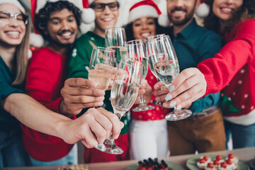 Photo of young funny cheerful people friends wear new year clothes drink wine celebrate corporate party indoors office