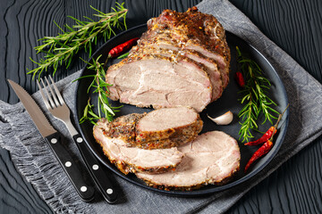 Roast Pork Neck sliced on a plate, top view