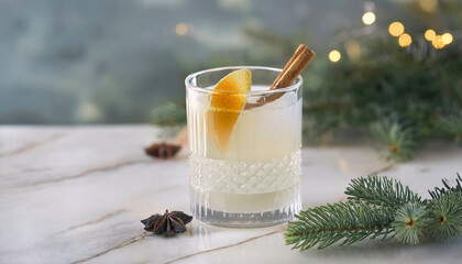 Elegant Christmas cocktail in whiskey tumbler glass with festive garnish, creamy winter holiday drink on marble table, gold accents, bokeh background, minimalist stylish holiday celebrations, parties