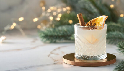 Elegant Christmas cocktail in whiskey tumbler glass with festive garnish, creamy winter holiday drink on marble table, gold accents, bokeh background, minimalist stylish holiday celebrations, parties