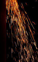 iskry, pomarańczowe iskry, iskry ze szlifierki, orange sparks, sparks from the grinder, Sparks from cutting metal of angle grinder, spark from the grinding wheel  © kateej