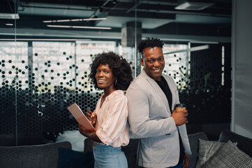Portrait of multiracial businesspeople at modern office smiling at camera
