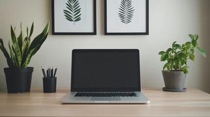 A minimalist desk setup featuring a sleek laptop, a potted plant, and soft lighting. This clean and organized workspace creates a calming atmosphere ideal for productivity and creativity