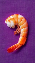 Shrimp on a purple textured background, seafood culinary concept