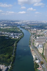 Fototapeta premium An aerial view of the south suburbs of Paris and the Seine River. France - September 1, 2024.