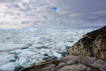  Many small icebergs in Disko Bay Greenland at Kitaa along the coastline