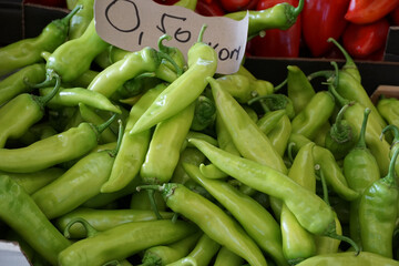 Fruits of domestic green pepper on the table of the city market