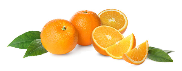 Fresh ripe oranges and green leaves on white background. Citrus fruit