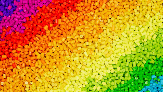 Closeup top view on piles of colorful rainbow polypropylene granules, masterbatch polymer grain rows. HDPE or PVC resin pellets. 3d render illustration
