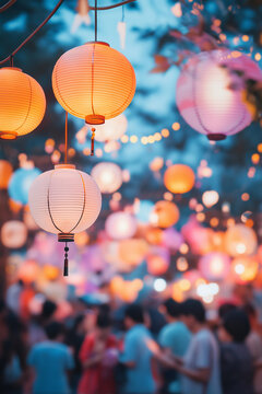Colorful paper lanterns illuminate a bustling night market.