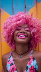 Portrait of a happy young black woman with pink hair