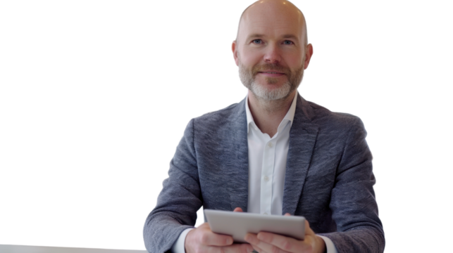 Middle-aged Caucasian male in tech environment with tablet on white background