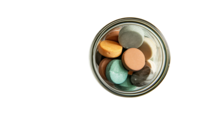 Candies in jar on white background