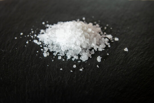 Sea salt on a black natural background.