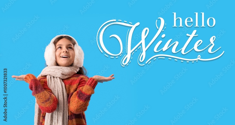 Wall mural Happy little girl in warm clothes on light blue background. Hello, winter