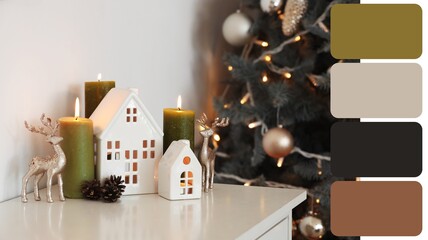 Burning candles with house shaped holders and Christmas decor on fireplace in room. Different color patterns