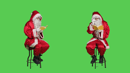 Saint nick reading novel story on chair, using book for lecture hobby as wise father christmas...