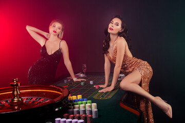 Photo of alluring gorgeous hot girls have christmas weekend in casino club bluff poker game