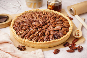 Tasty pecan pie on light background