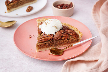 Plate with piece of tasty pecan pie on light background