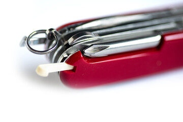 Swiss army knife on a white background.  Macro shot.