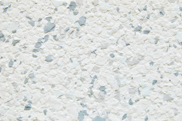 Gray decorative multi color flakes wall texture or pattern as background