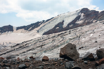The glacier carves intricate patterns into the rock, revealing the raw beauty of the natural world.