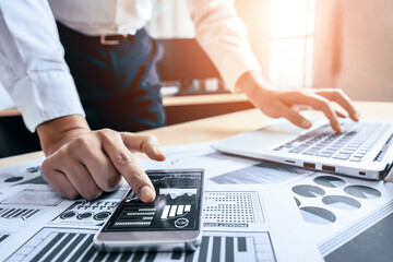 Businessman accountant or financial expert analyze business report graph and finance chart at corporate office. Concept of finance economy, banking business and stock market research. uds
