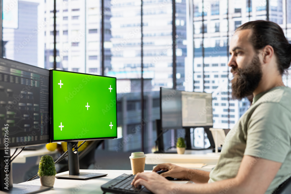 Poster technician conducting code review on isolated screen computer to fix bugs, identifying performance a