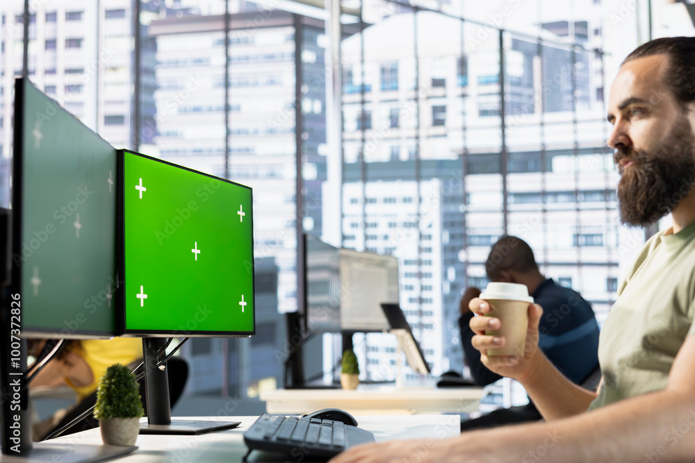 Aufkleber employee looking at mockup pc monitor, drinking coffee, checking data needed for finding business in