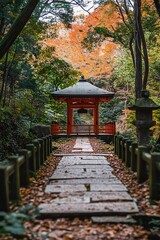 Stone path leading to red pagoda in Japanese garden during autumn with colorful trees
