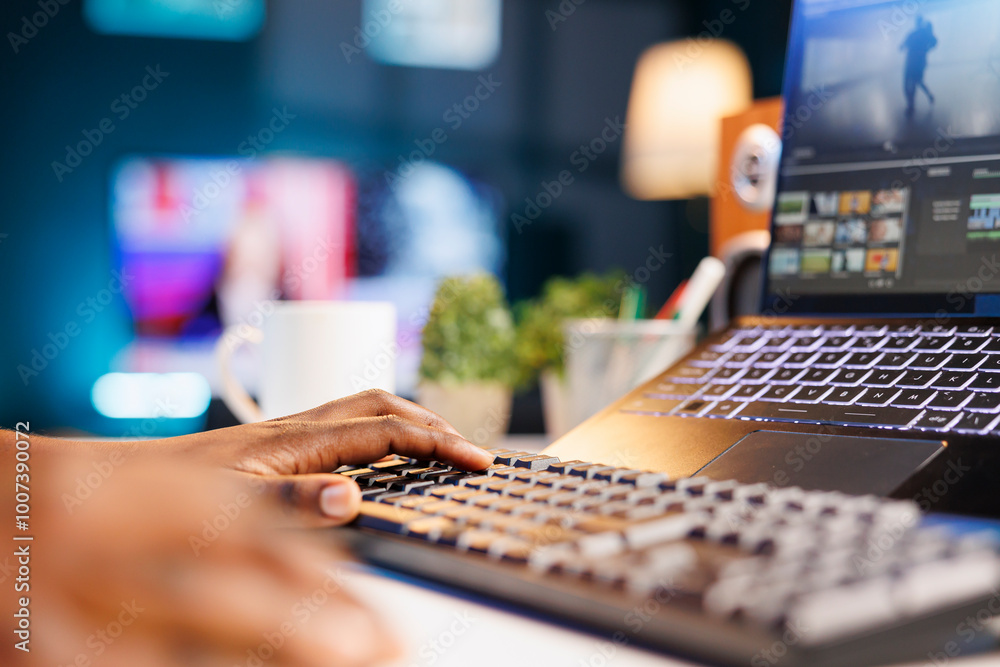 Aufkleber black person editing and creating digital content using her laptop and keyboard. african american pr